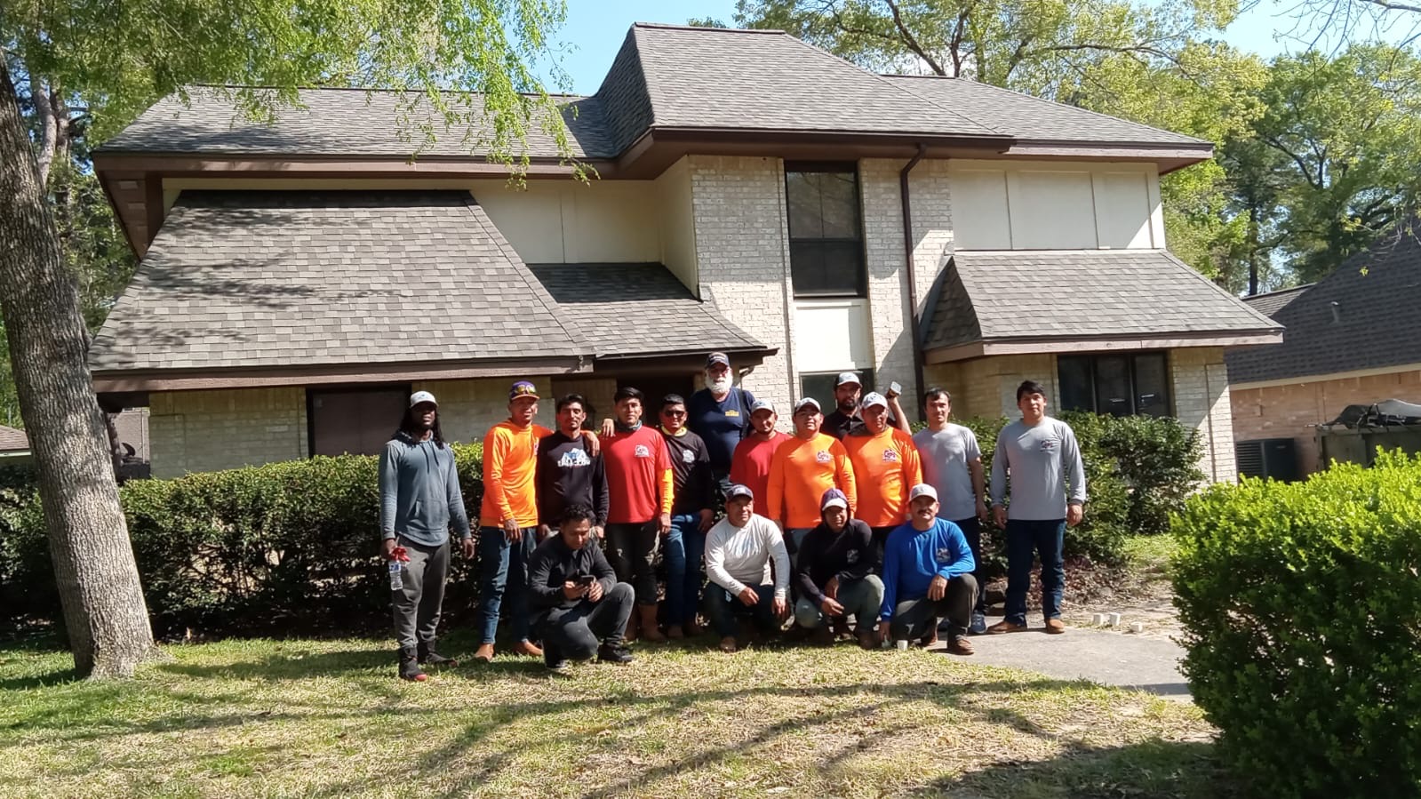 Roof Repair Company crew at a finished roof