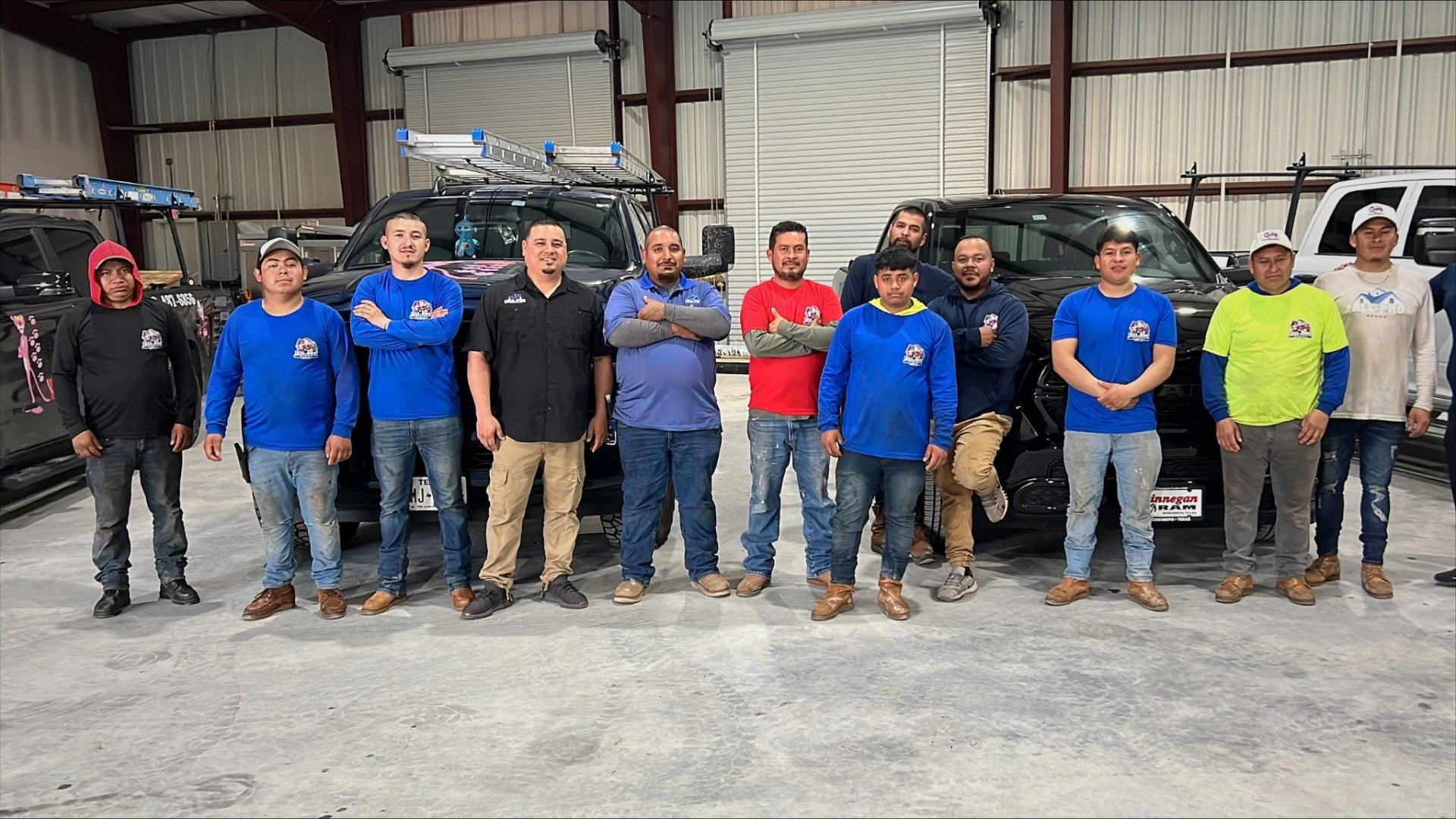 Roof Repair Company crew with work trucks