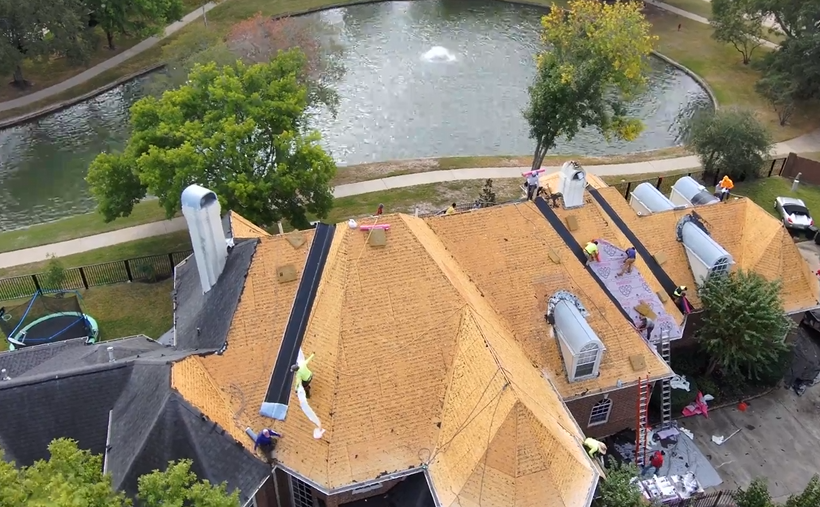 Roof Repair Company crew performing roof replacement